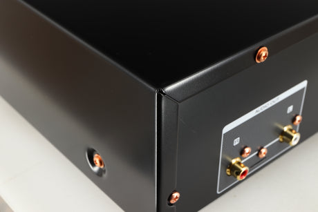 Close up of a used Marantz CD6007 CD Player in a black finish showing some scratching