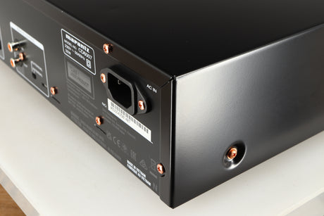 Rear left corner of a used Marantz CD6007 CD Player in a black finish