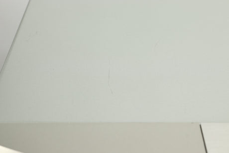 Close up view of a small scratch on the top of a used Marantz CD6007 CD Player in silver finish 