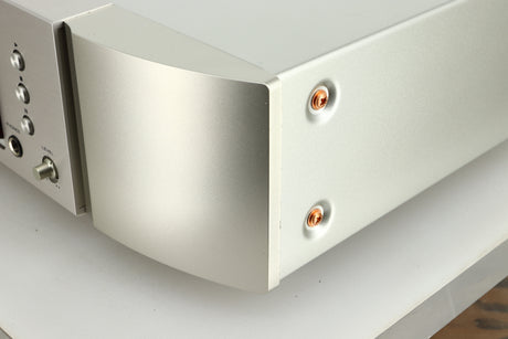 Close up view of the front right corner of a used Marantz CD6007 CD Player in silver finish 