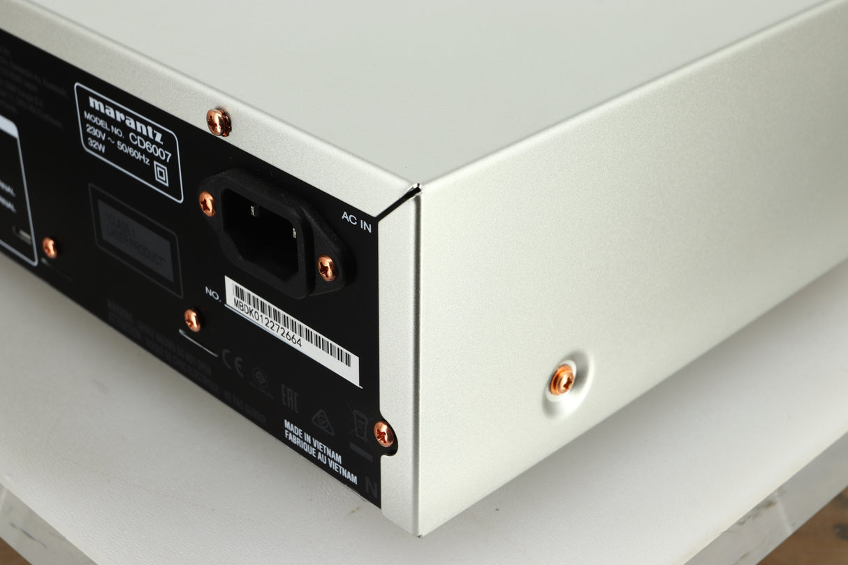 Close up view of the rear right corner of a used Marantz CD6007 CD Player in silver finish 