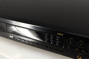Close up of a used Marantz CD63 KI Signature CD Player in a black finish showing scratching on screen