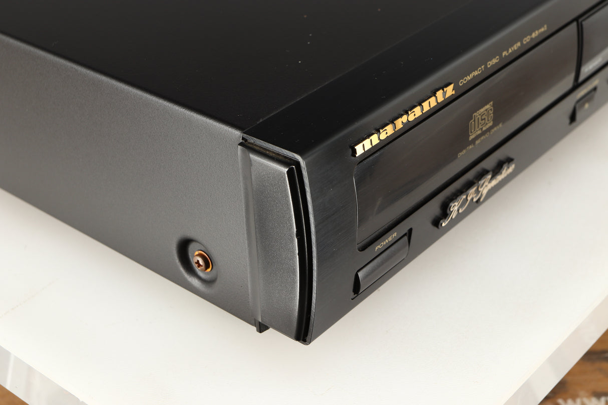 Front left corner of a used Marantz CD63 KI Signature CD Player in a black finish