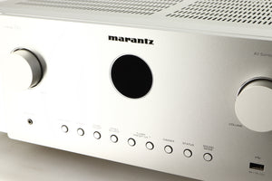 Close up of a used Marantz Cinema 60 AV Receiver in a silver finish showing some of the fascia
