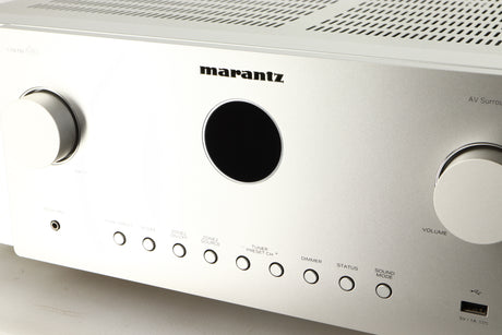Close up of a used Marantz Cinema 60 AV Receiver in a silver finish showing some of the fascia