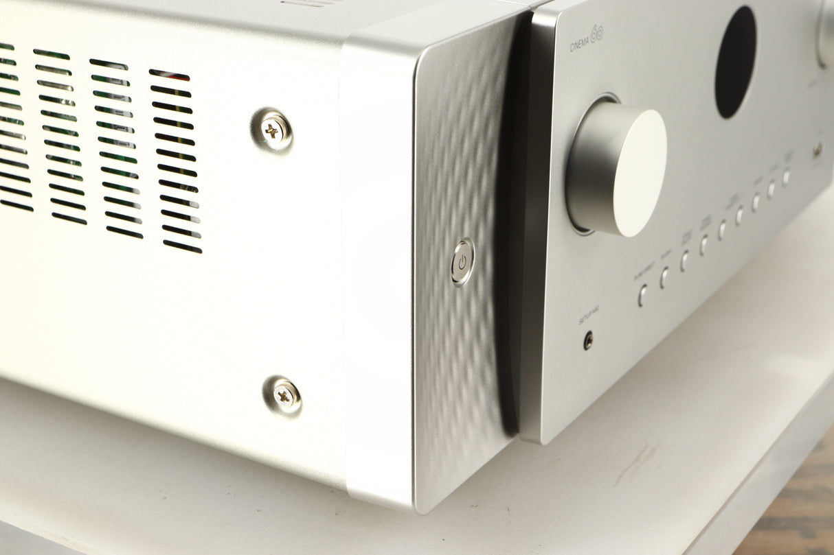 Front left corner of a used Marantz Cinema 60 AV Receiver in a silver finish