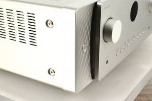 Front left corner of a used Marantz Cinema 60 AV Receiver in a silver finish