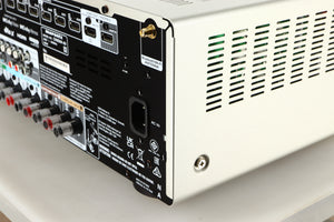 Rear left corner of a used Marantz Cinema 60 AV Receiver in a silver finish
