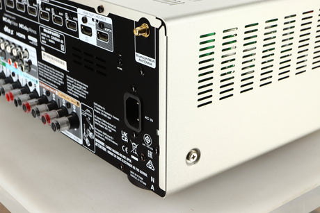 Rear left corner of a used Marantz Cinema 60 AV Receiver in a silver finish