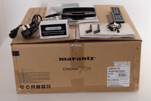 Box of a used Marantz Cinema 70s AV Amplifier in Black with Mains Cable, Manual, Remote, 2x Antenna, AM/FM Aerials, Audyssey Setup Mic, and Mic Stand