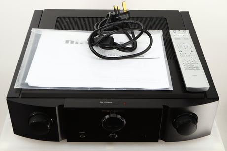 Top of a used Marantz KI Ruby Integrated Amplifier in a black finish showing Manual, Mains Cable and Remote