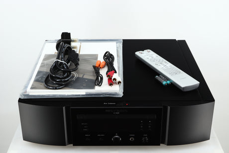 Top of a used Marantz KI Ruby Limited Edition SACD Player in a black finish showing Manual, Mains Cable, 2x Interconnect Cables, Remote and 2x Batteries