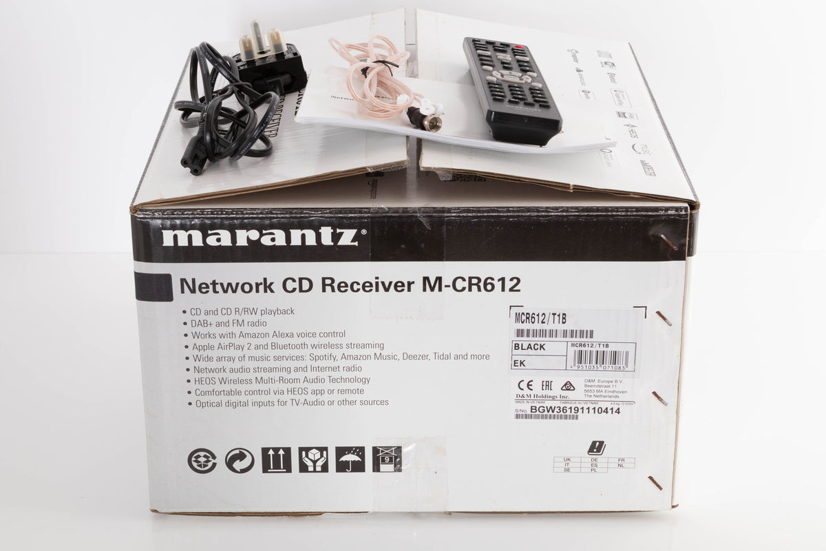 Box of a used Marantz M-CR612 Network CD Receiver in Black with mains cable, manual, remote, and aerial