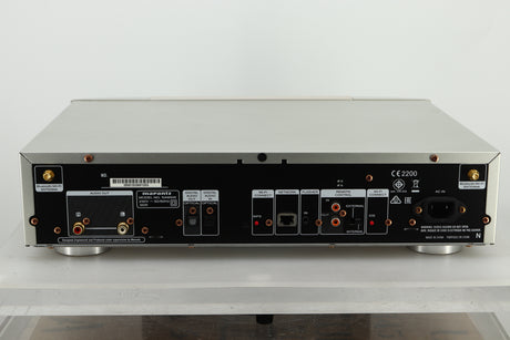 Back view of a used Marantz NA6005 Network Player in silver finish showing RCA outputs, Optical in and out, ethernet input, and mains input