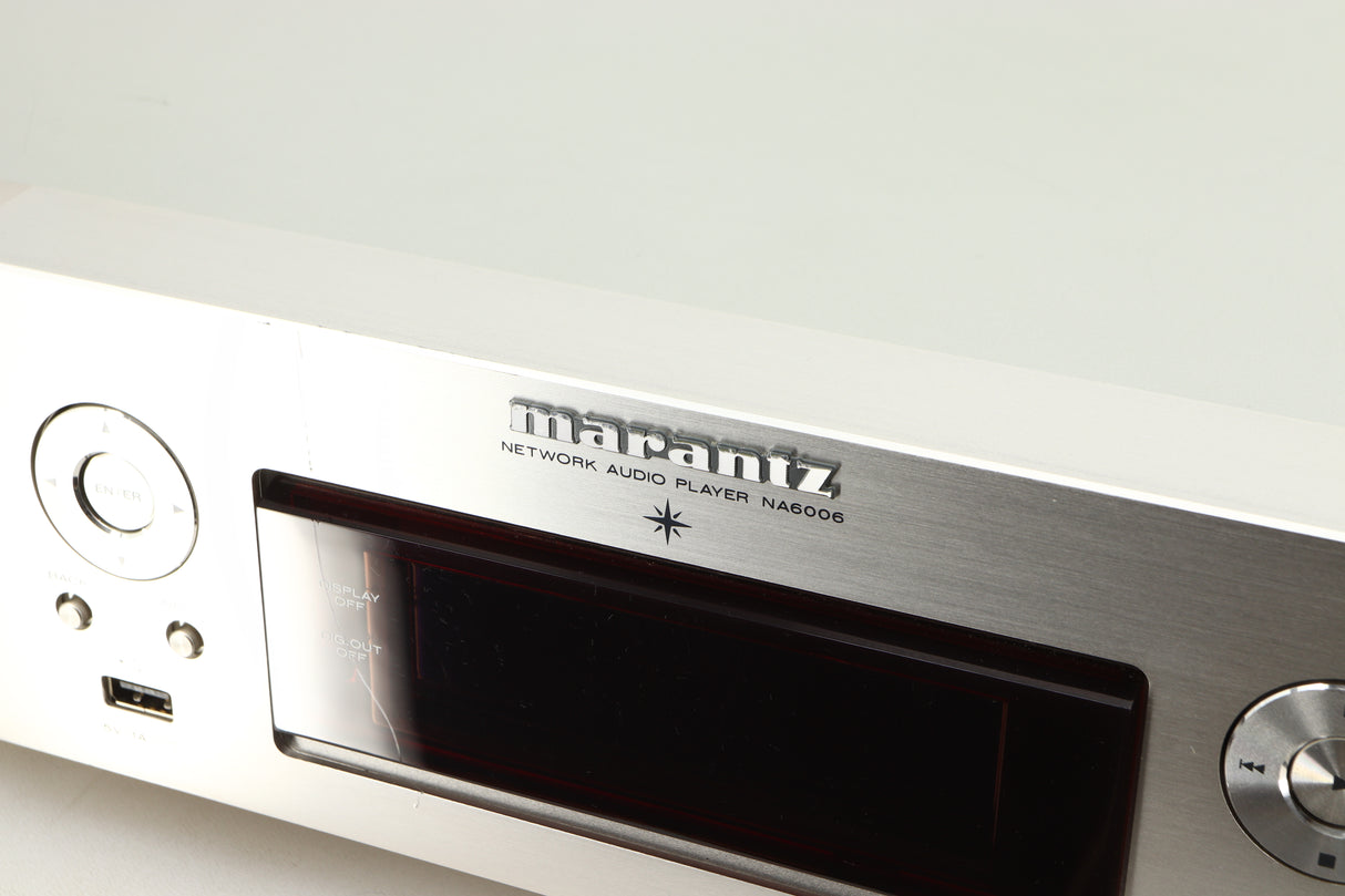 Close up of a used Marantz NA6006 Network Player in a silver finish showing scratch on fascia and screen