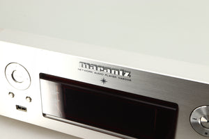 Close up of a used Marantz NA6006 Network Player in a silver finish showing scratch on fascia and screen