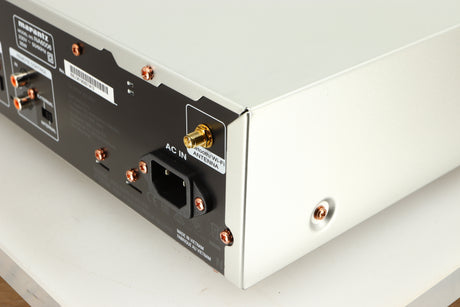 Rear left corner of a used Marantz NA6006 Network Player in a silver finish