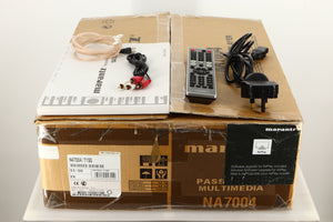 Box of a used Marantz NA7004 Network Streamer in Silver finish with manual, mains cable, remote, interconnects, and aerial
