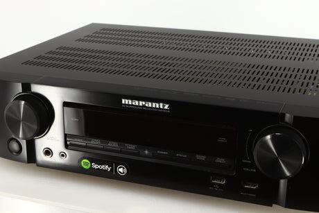Close up of a used Marantz NR1606 AV Receiver in a black finish showing fascia