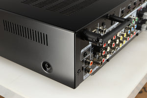 Rear right corner of a used Marantz NR1606 AV Receiver in a black finish
