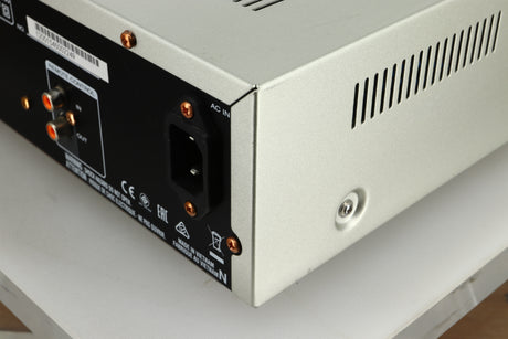 Close up view of the rear right corner of a used Marantz PM6005 Integrated Amplifier in silver finish