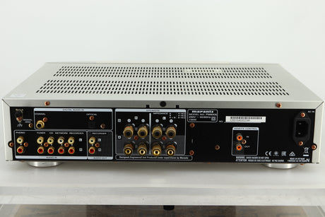 Rear view of a used Marantz PM6005 Integrated Amplifier in silver finish showing RCA, coaxial, and optical inputs, speaker outputs, and a power input