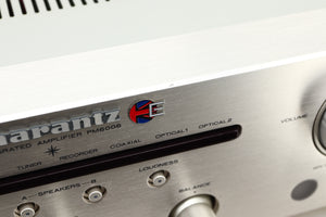 Close up view of a used Marantz PM6006 UK Edition Integrated Amplifier in Silver finish showing scratching on the front edge