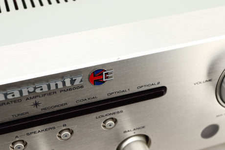 Close up view of a used Marantz PM6006 UK Edition Integrated Amplifier in Silver finish showing scratching on the front edge
