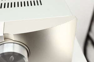 Close up view of a used Marantz PM6006 UK Edition Integrated Amplifier in Silver finish showing scratching on the front edge on the right side
