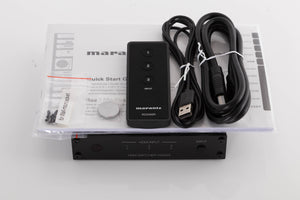 Top of a used Marantz VS3003 3 Port HDMI Switch in a Black finish showing Manual, Screws, Remote, Battery, USB Cable and HDMI Cable