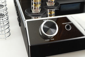 Close up view of a used McIntosh MA252 Integrated Amplifier showing scratching on the left side of the fascia 