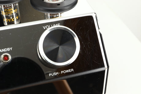 Close up view of a used McIntosh MA252 Integrated Amplifier showing scratching on the right side of the fascia 