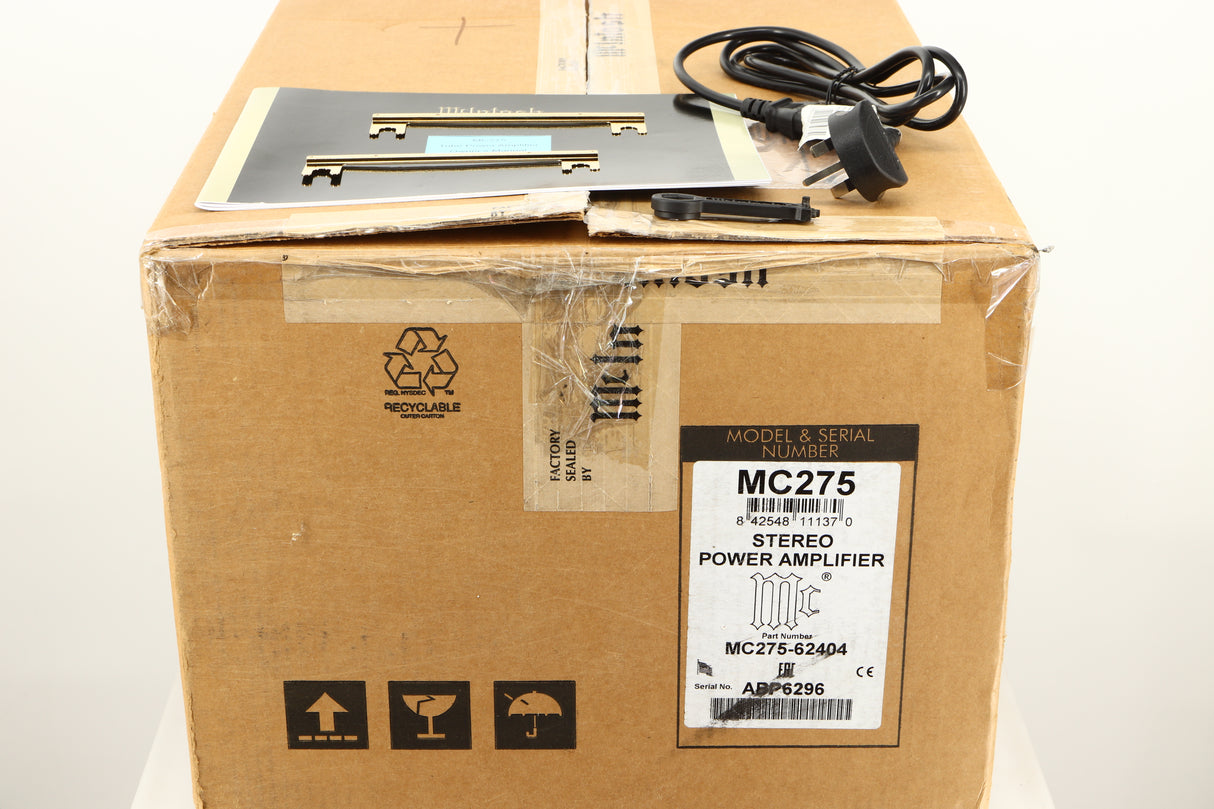 Box of a used McIntosh MC275 MK VI Power Amplifier showing Mains Cable, Manual, 2x Terminal Links, and Terminal tool