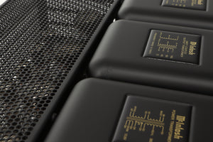 Close up view of a used McIntosh MC275 MK VI Power Amplifier showing scratching on the top