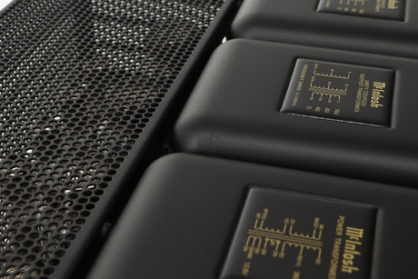 Close up view of a used McIntosh MC275 MK VI Power Amplifier showing scratching on the top