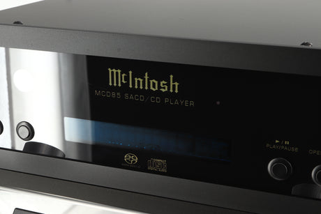 Close up of a used McIntosh MCD85 CD / SACD Player in a silver / black finish showing some wear on screen 