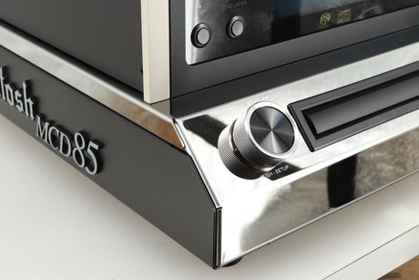Front left corner of a used McIntosh MCD85 CD / SACD Player in a silver / black finish