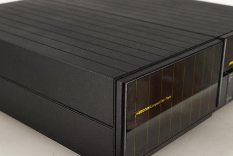 Close up of a used Meridian 200 CD Transport in a black finish showing small marks
