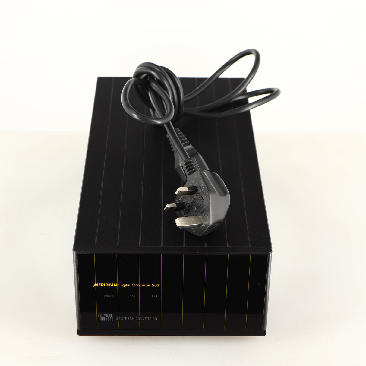 Top of a used Meridian 203 Digital Analogue Converter in a black finish showing Mains Cable