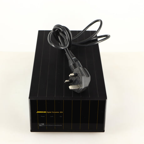 Top of a used Meridian 203 Digital Analogue Converter in a black finish showing Mains Cable