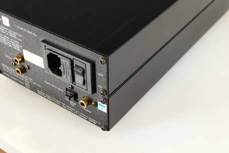 Rear left corner of a used Meridian 203 Digital Analogue Converter in a black finish