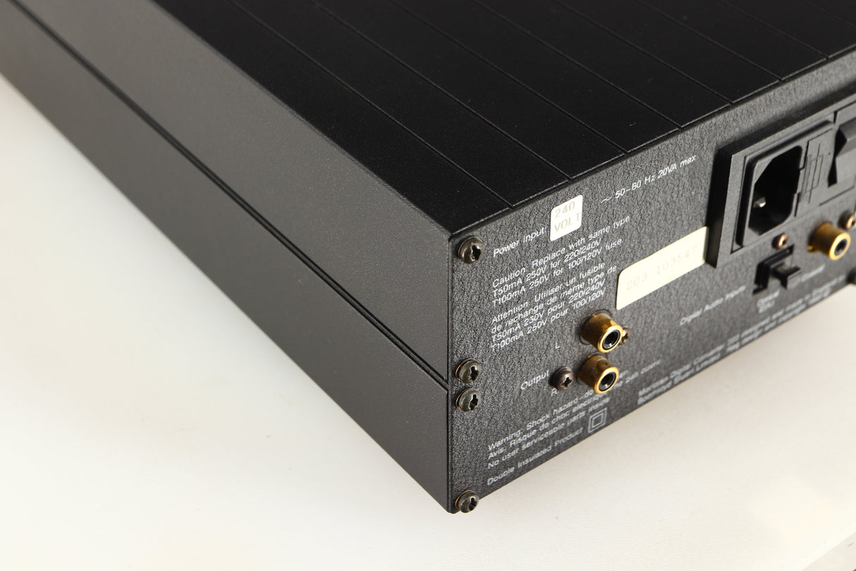 Rear right corner of a used Meridian 203 Digital Analogue Converter in a black finish