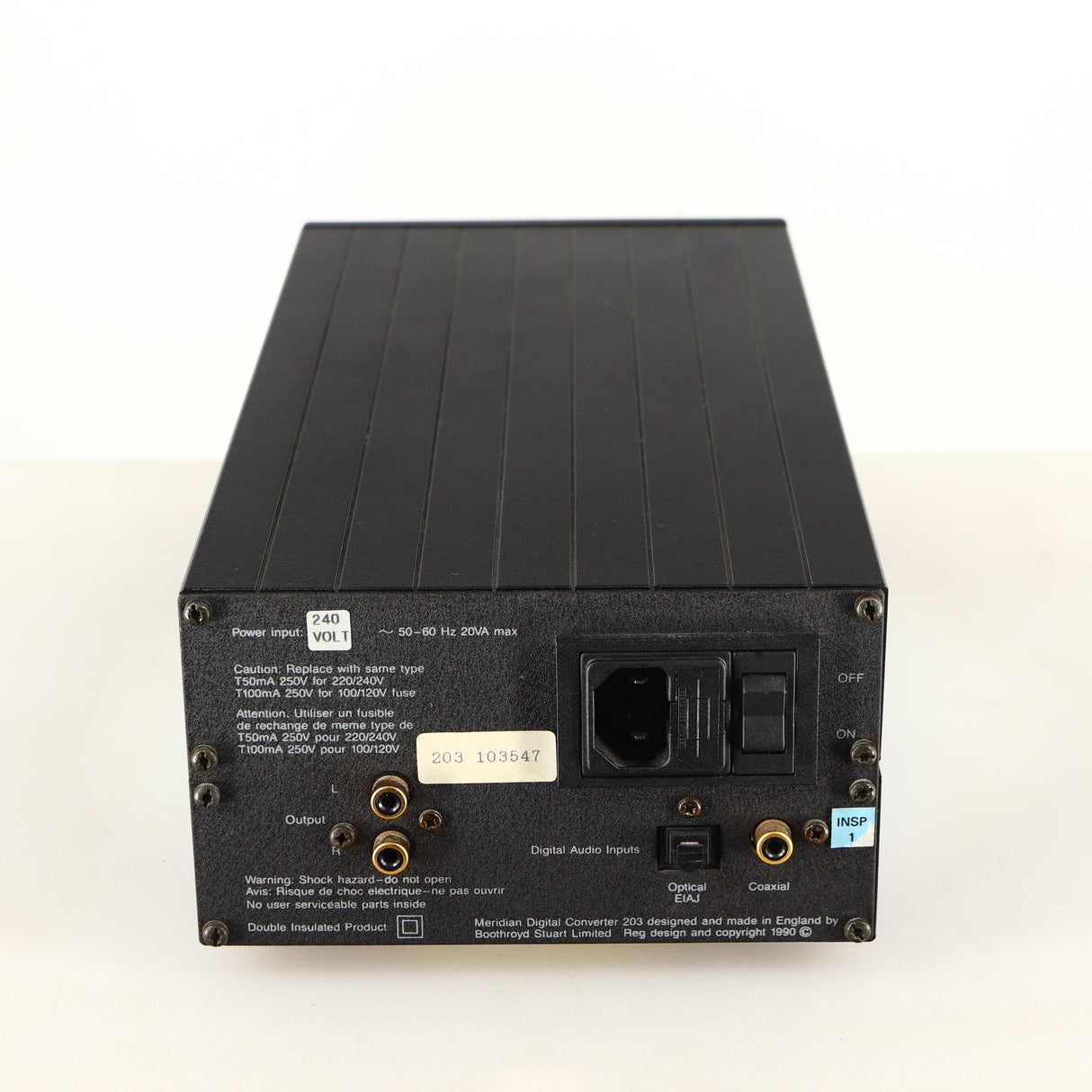 Rear view of a used Meridian 203 Digital Analogue Converter in a black finish showing Mains Input, Phono Input, Phono Outputs and Optical Input