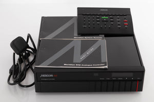 Front view of a used Meridian 502 Pre Amplifier with mains cable, manual, and MSR System Remote 