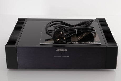 Front view of a used Meridian 505 Single Monoblock Power Amplifier with mains cable and manual