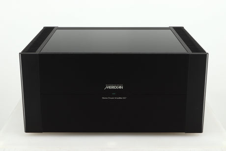 Front view of a used Meridian 557 Power Amplifier in a black finish