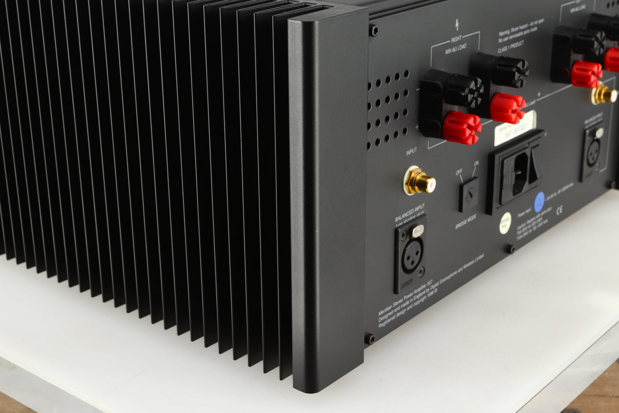 Rear right corner of a used Meridian 557 Power Amplifier in a black finish