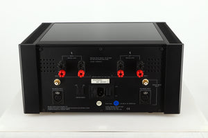 Rear view of a used Meridian 557 Power Amplifier in a black finish showing Speaker Inputs, Balance Inputs and Mains Input