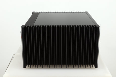 Left side view of a used Meridian 557 Power Amplifier in a black finish