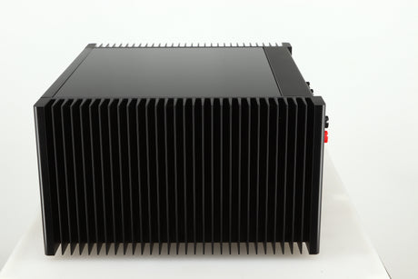 Right side view of a used Meridian 557 Power Amplifier in a black finish
